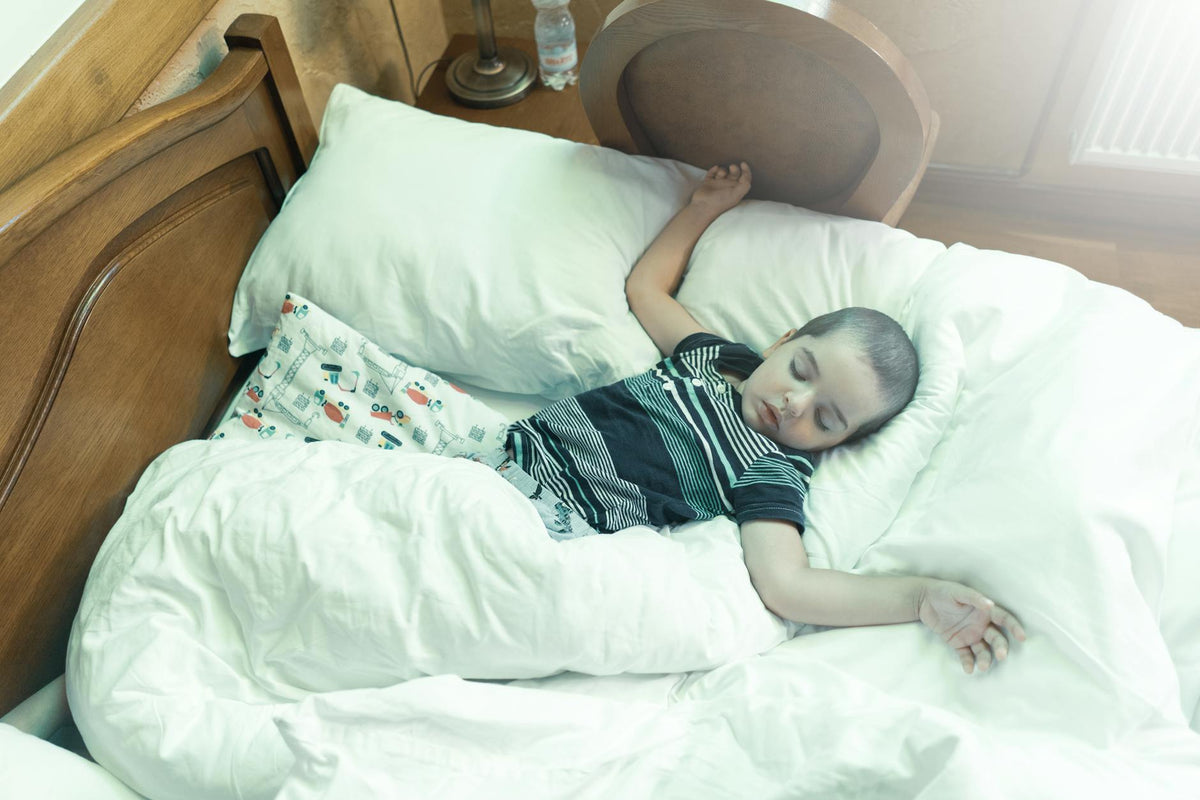 Toddler asleep in soft natural light