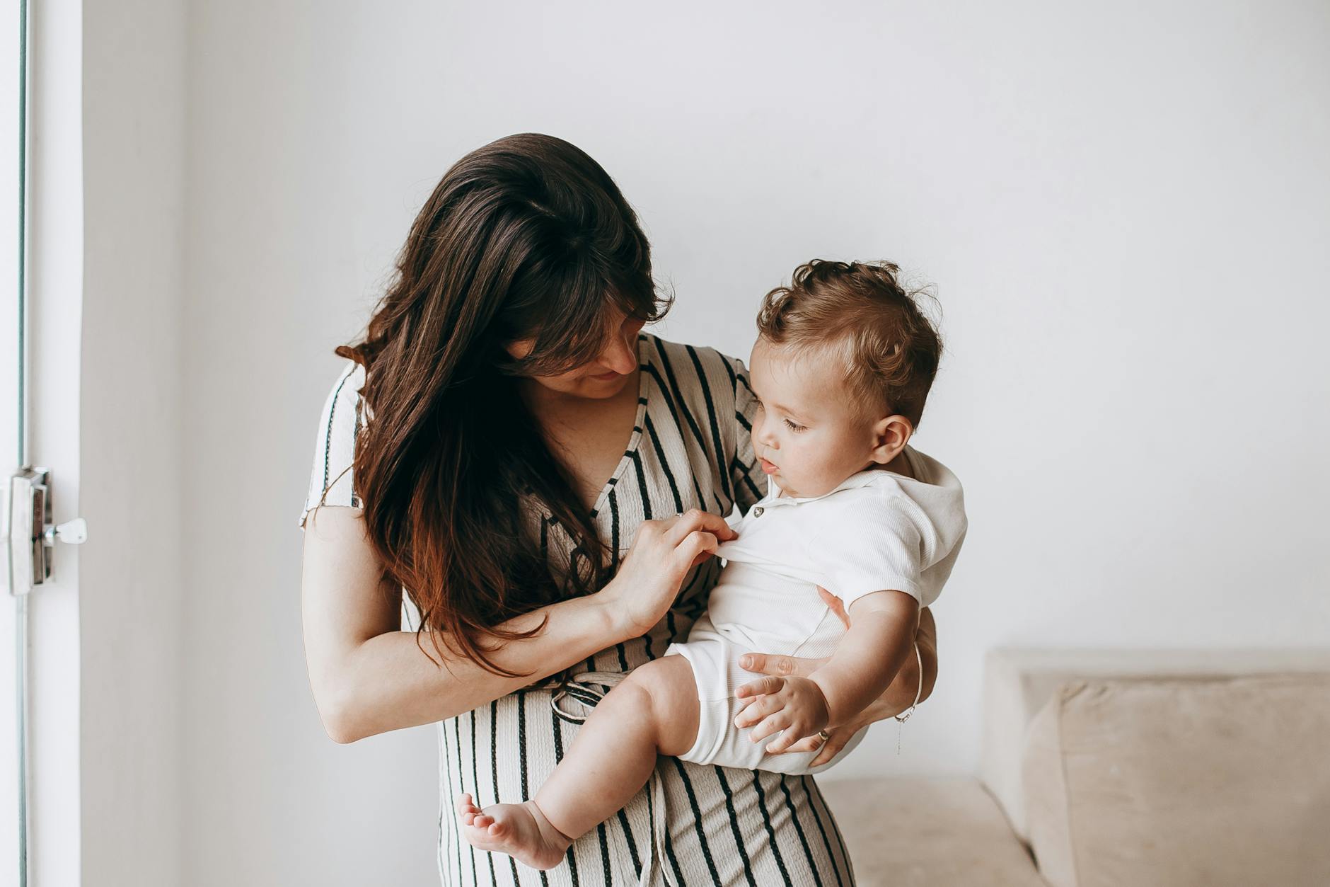 Mother holding her baby with warmth and calm